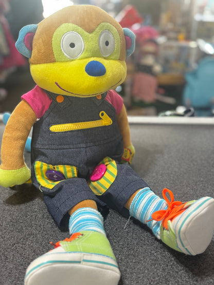 plush Alex Toys Little Hands Learn to Dress Monkey educational doll.
