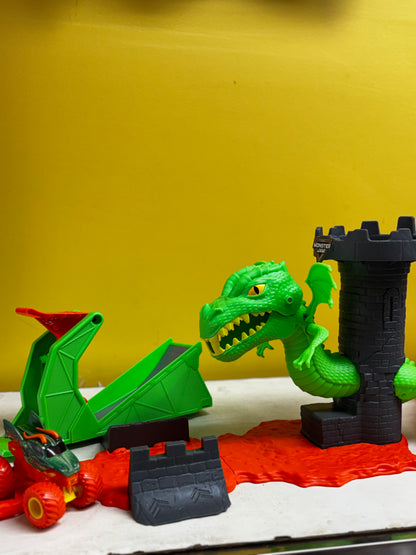 Monster Jam Dueling Dragon Playset featuring a green dragon and gray castle tower