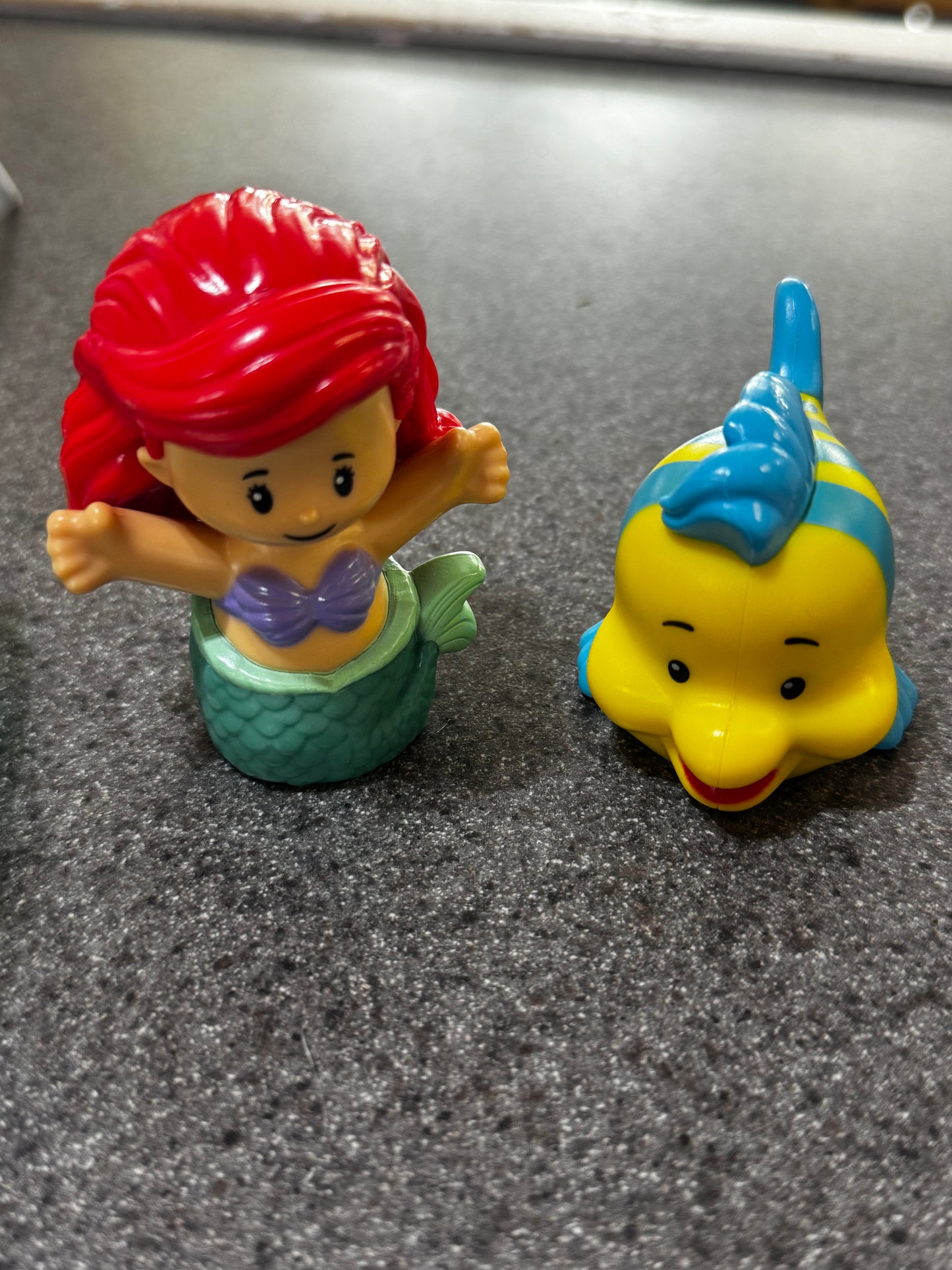 Fisher-Price Little People Disney Princess Ariel and Flounder figures.